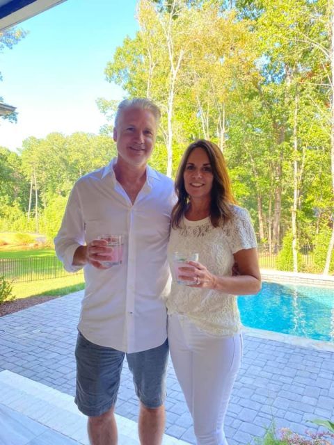 Sean and her ex-wife was  wearing white color cloths and holding cup on hand .